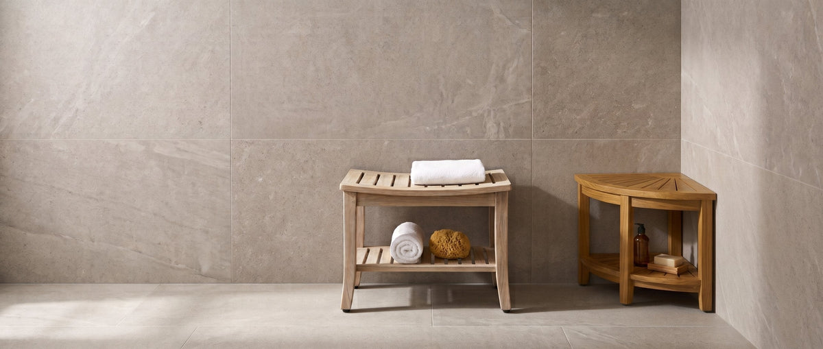 Teak corner shower bench and straight teak shower bench in a spa-style walk-in shower