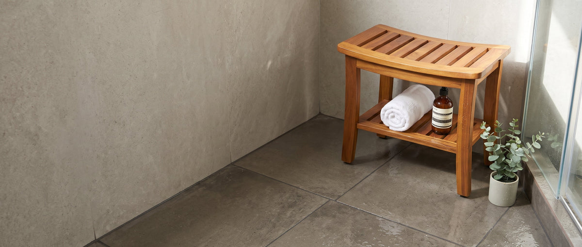 TeakCraft Hermod teak shower bench in a spa-style walk-in shower